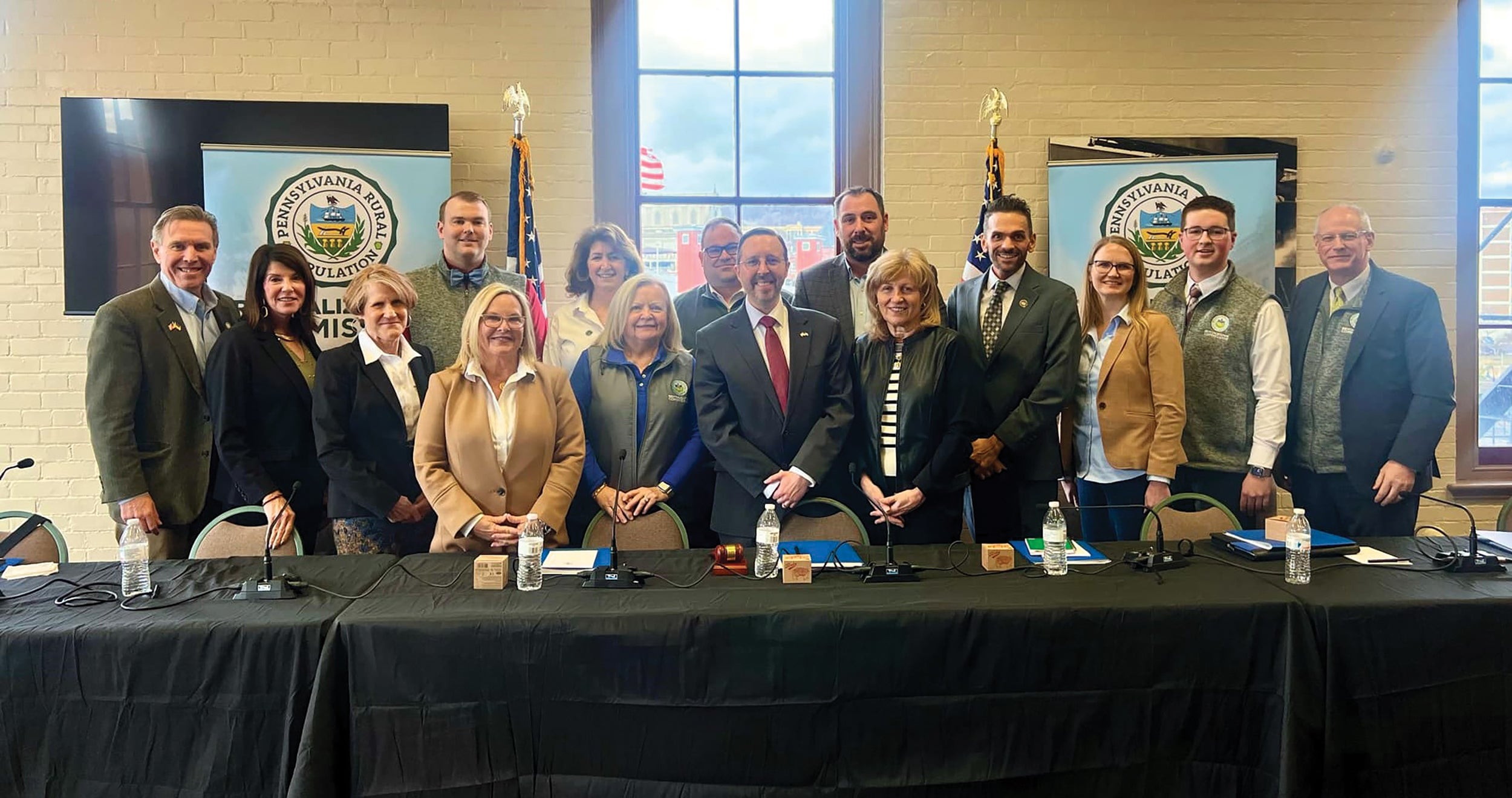 Dr. Kyle Kopko, center, who chairs the state’s new Rural Population Revitalization Commission, is shown at a recent meeting with the group’s members