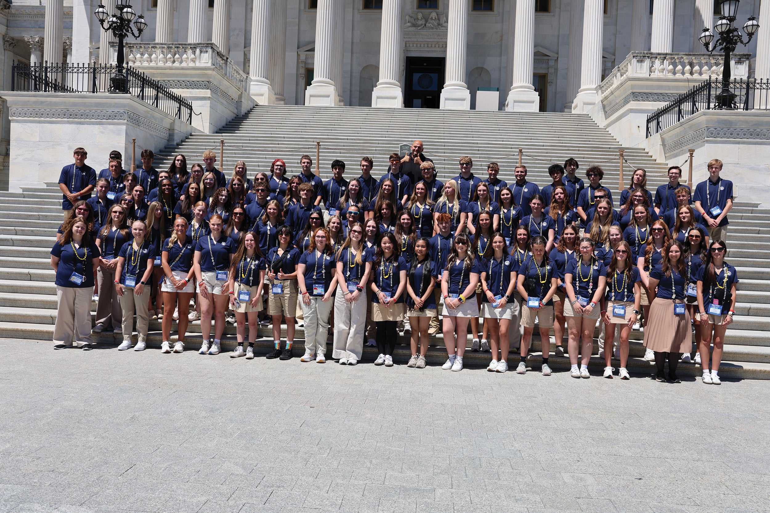 U.S. Sen. John Fetterman (D-Pa.) joins 2026 Youth Tour students on the capitol steps during a weeklong tour of Washington, D.C.